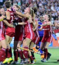 England players celebrate after defeating Argentina during their Women's Hockey World League third place match in Tucuman, Argentina, on December 8, 2013. AFP PHOTO / WALTER MONTEROS (Photo credit should read Walter Monteros/AFP/Getty Images)